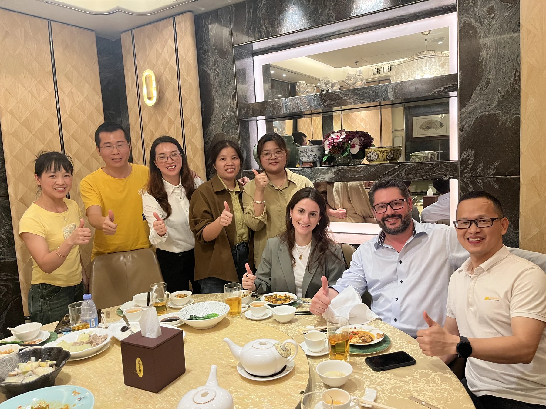 NAIKE GROUP team sharing dinner with international clients