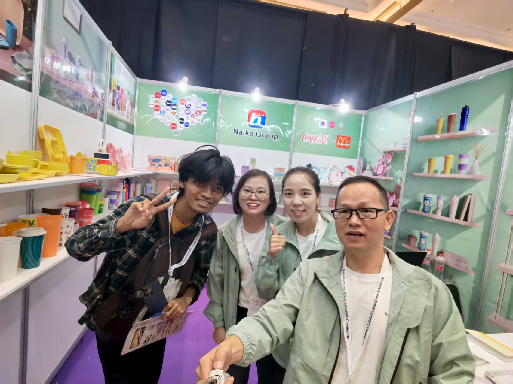 NAIKE GROUP team meeting visitors at an exhibition in Indonesia