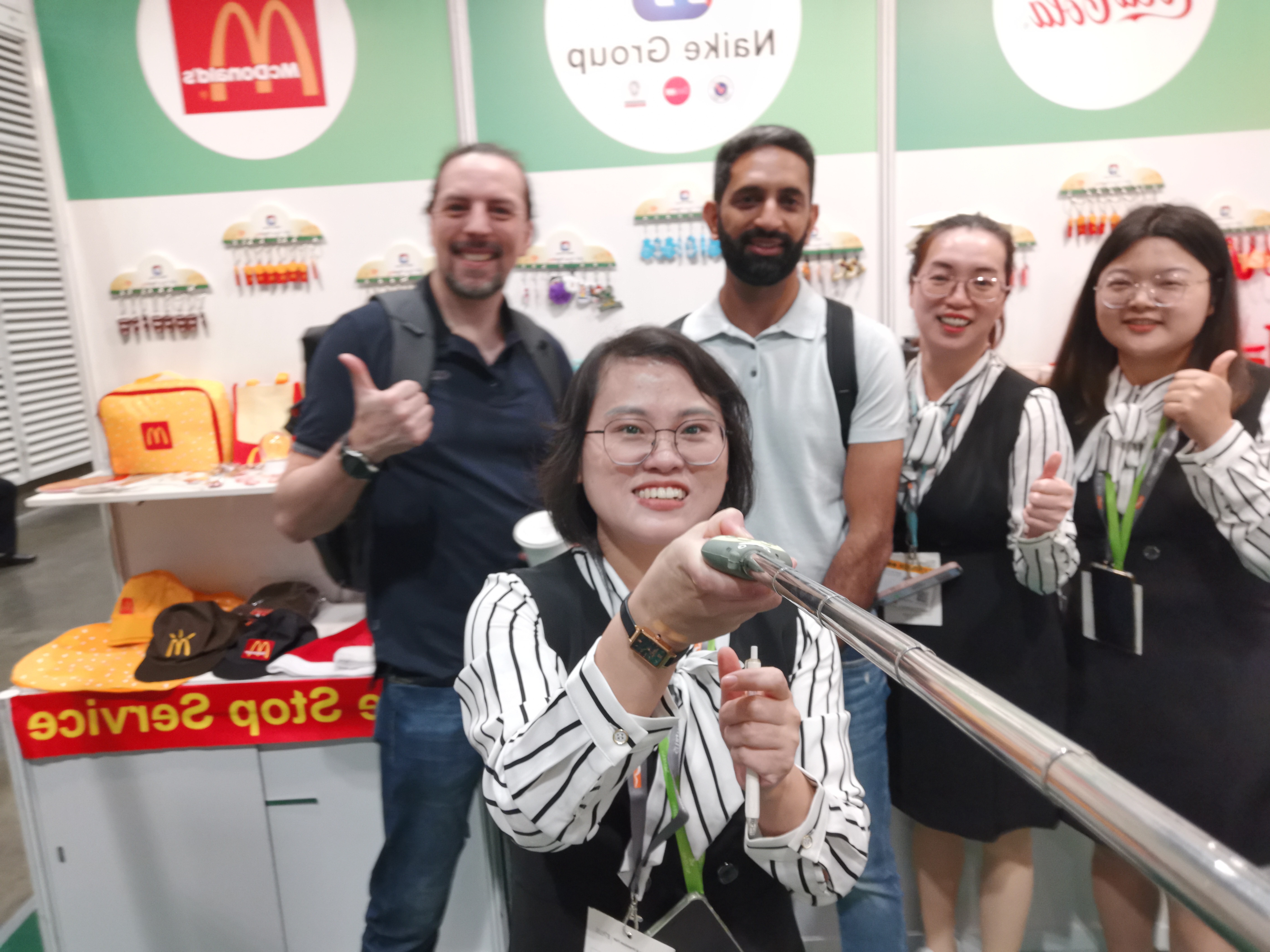 NAIKE GROUP team speaking with international buyers at a Hong Kong exhibition